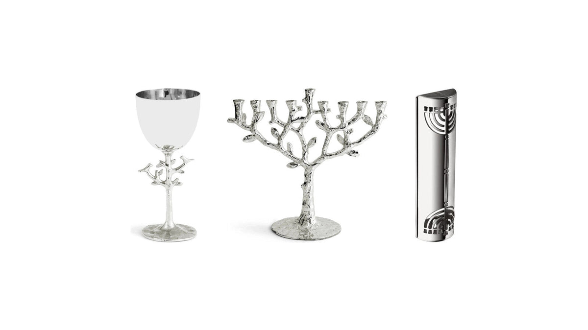 Michael Aram Tree of Life menorah and kiddush cup with a Christofle silver-plated mezuzah
