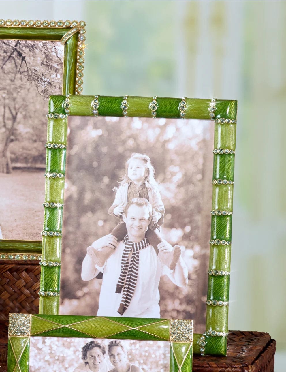 Jay Strongwater Pierced Striped frame in green, size 5x7". displayed with a black and white photograph