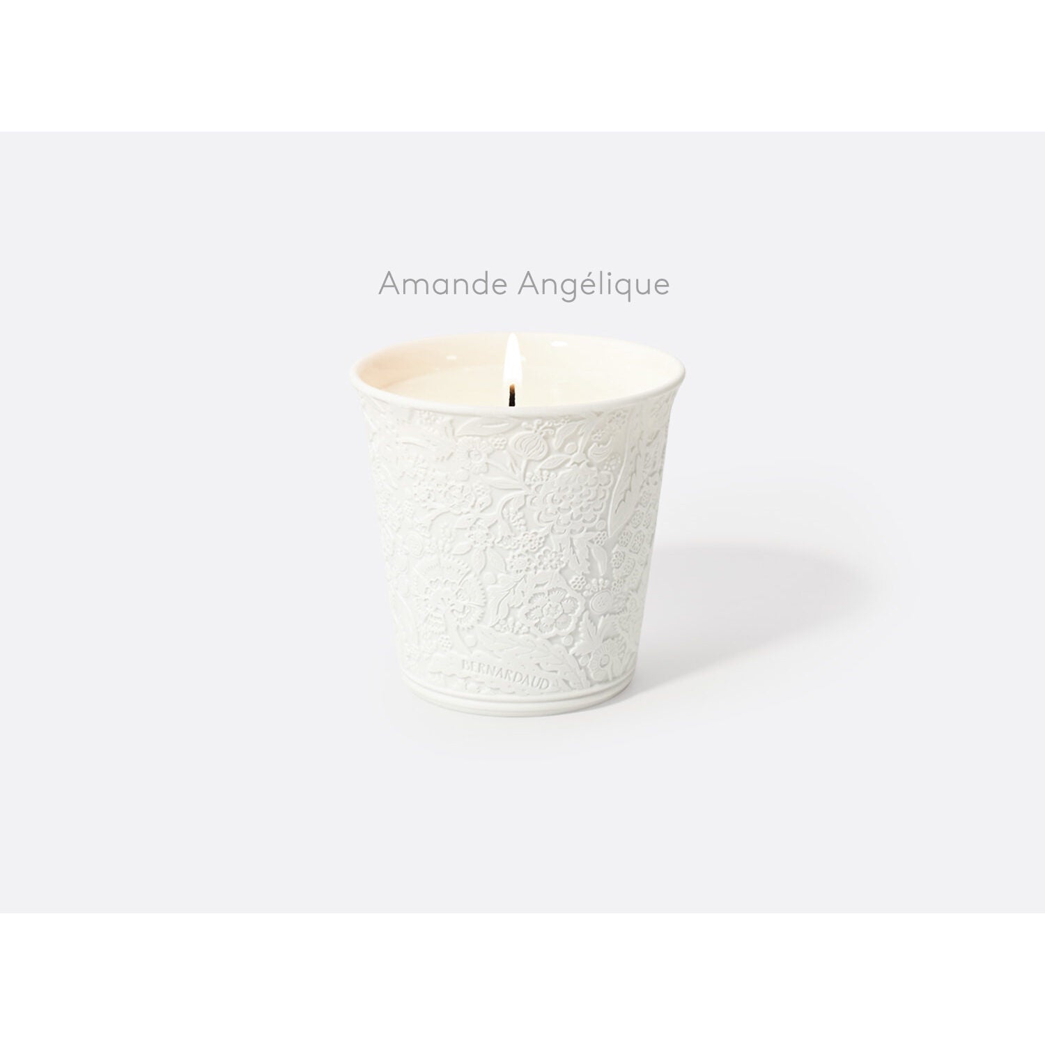 Bernardaud "Amande Angélique" refillable candle tumbler in engraved bisque porcelain 7 oz, Limoges porcelain, Home Fragrances collection, on a white background
