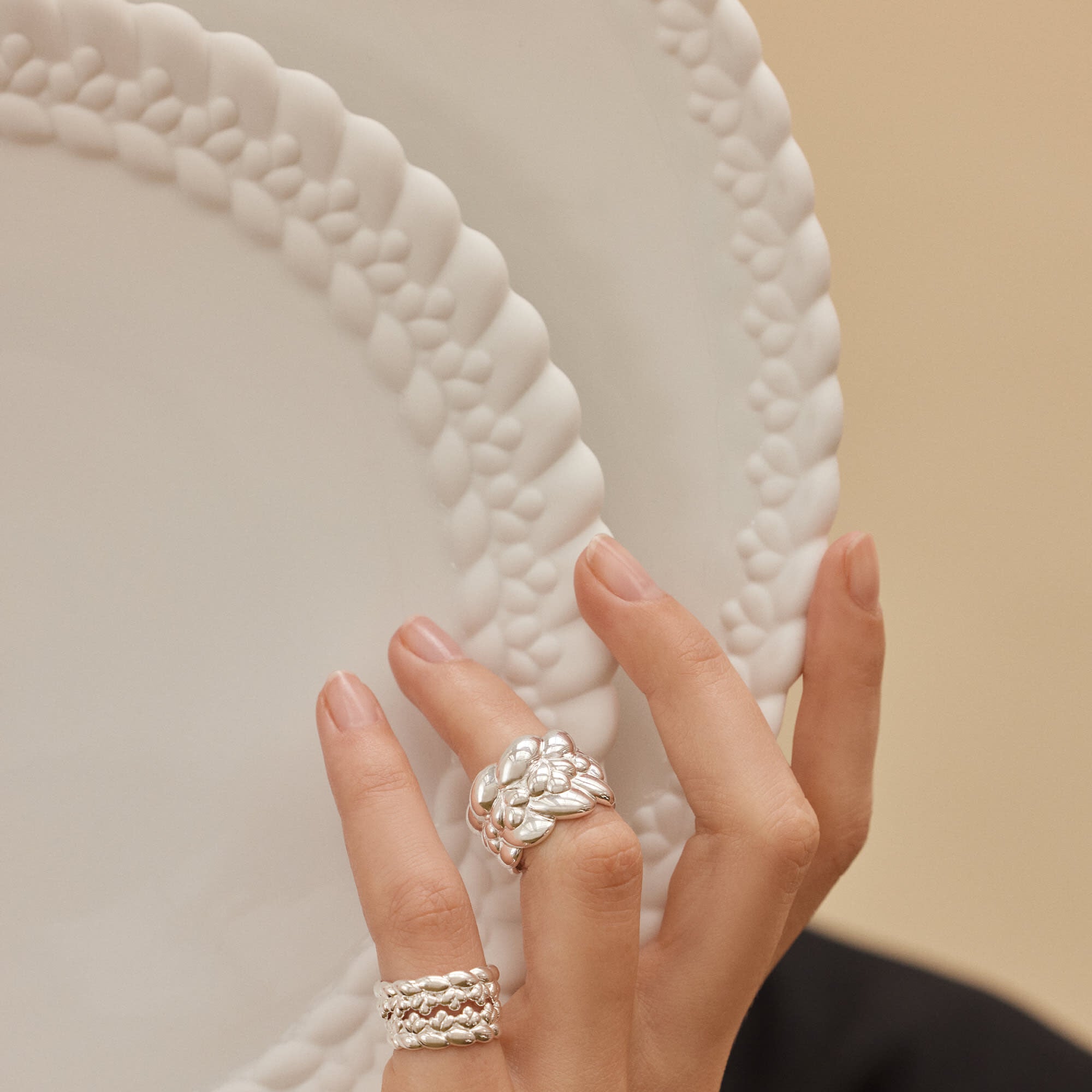Christofle Babylone Porcelain Dinner Plate in sterling silver on a white background
