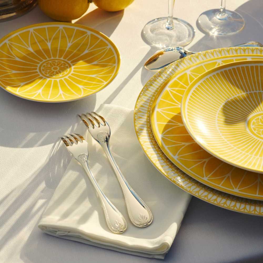 Christofle Porcelain Dinner Plate in silver-plate on a white background
