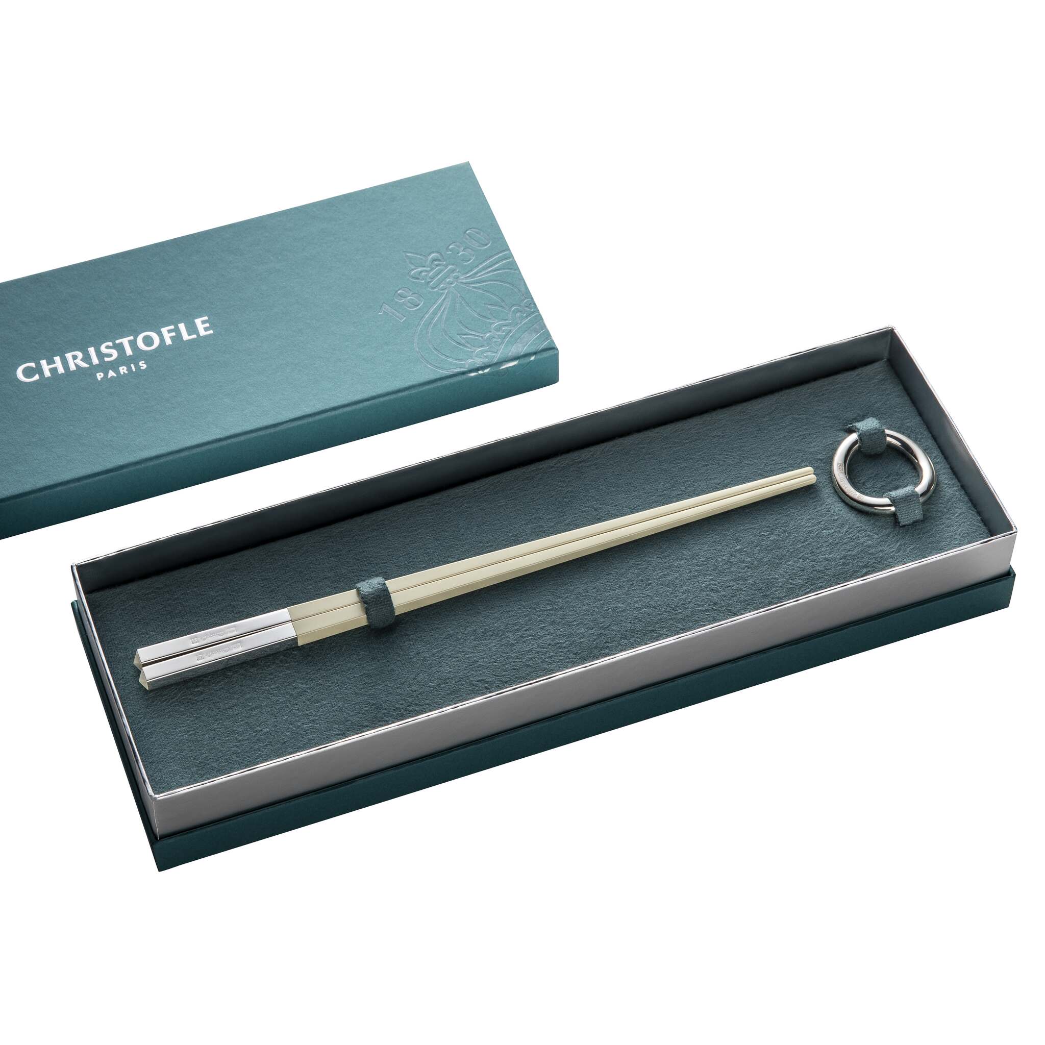 Christofle Chinese Chopsticks and Chopsticks Rest - Off White in silver-plate on a white background