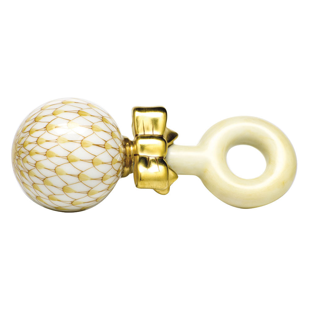 Hand-painted Herend Baby Rattle Figurine in Butterscotch fishnet porcelain on a white background