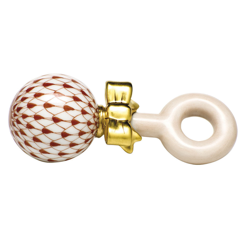 Hand-painted Herend Baby Rattle Figurine in Rust fishnet porcelain on a white background