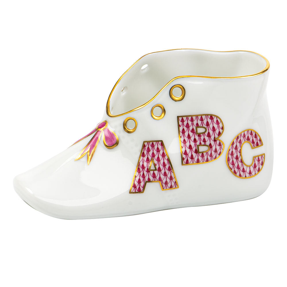 Hand-painted Herend Baby Shoe with Abc Baby Keepsake in Raspberry fishnet porcelain on a white background