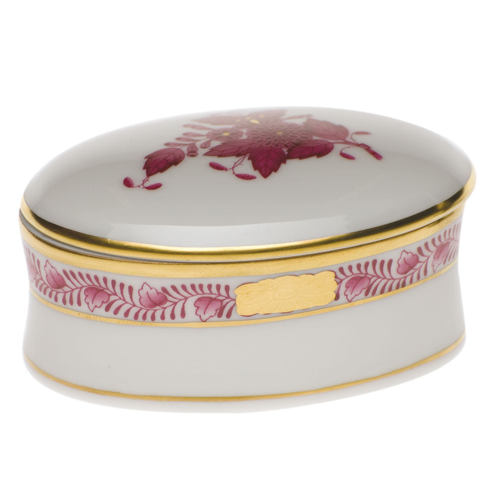 Hand-painted Herend Chinese Bouquet Raspberry Oval Box in fine porcelain, 2.75in L X 1.25in H, on a white background
