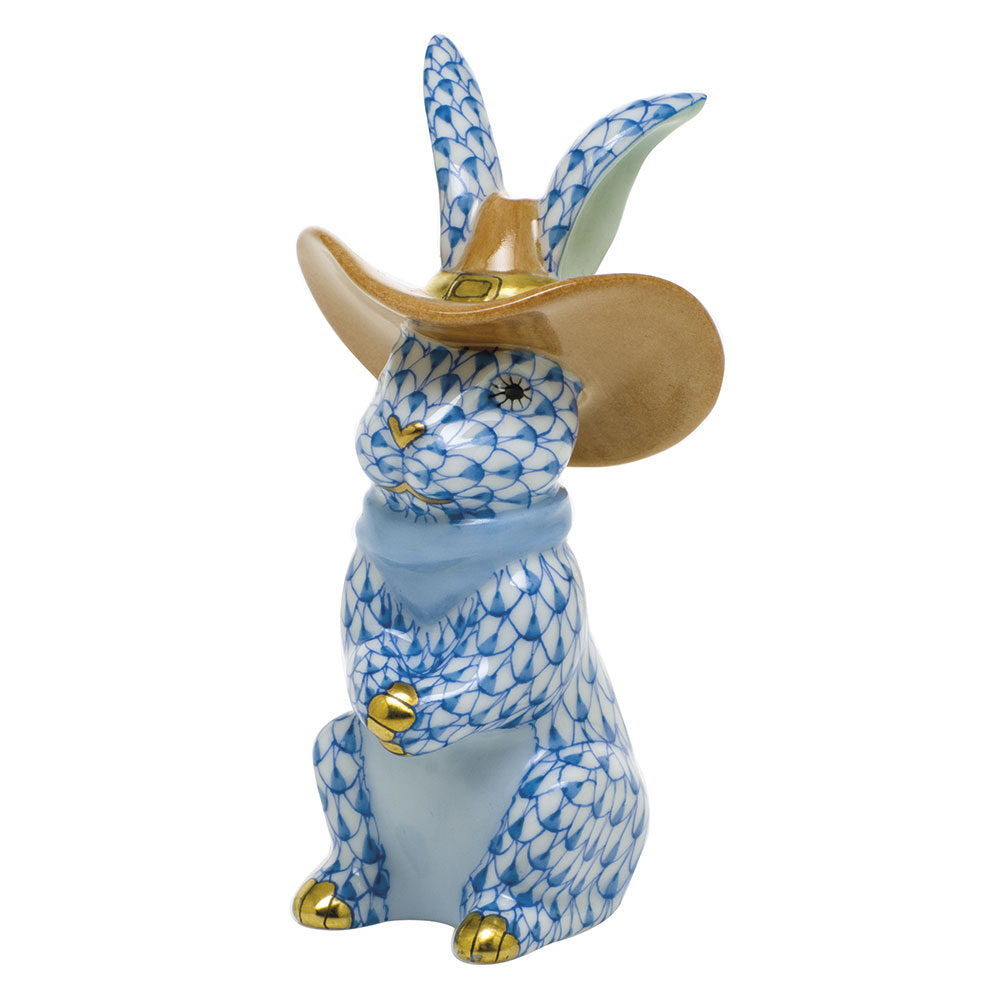 Hand-painted Herend Cowboy Bunny Figurine in Blue fishnet porcelain on a white background