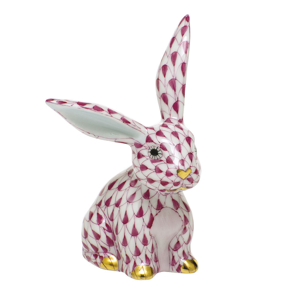 Hand-painted Herend Funny Bunny Figurine in Raspberry fishnet porcelain on a white background