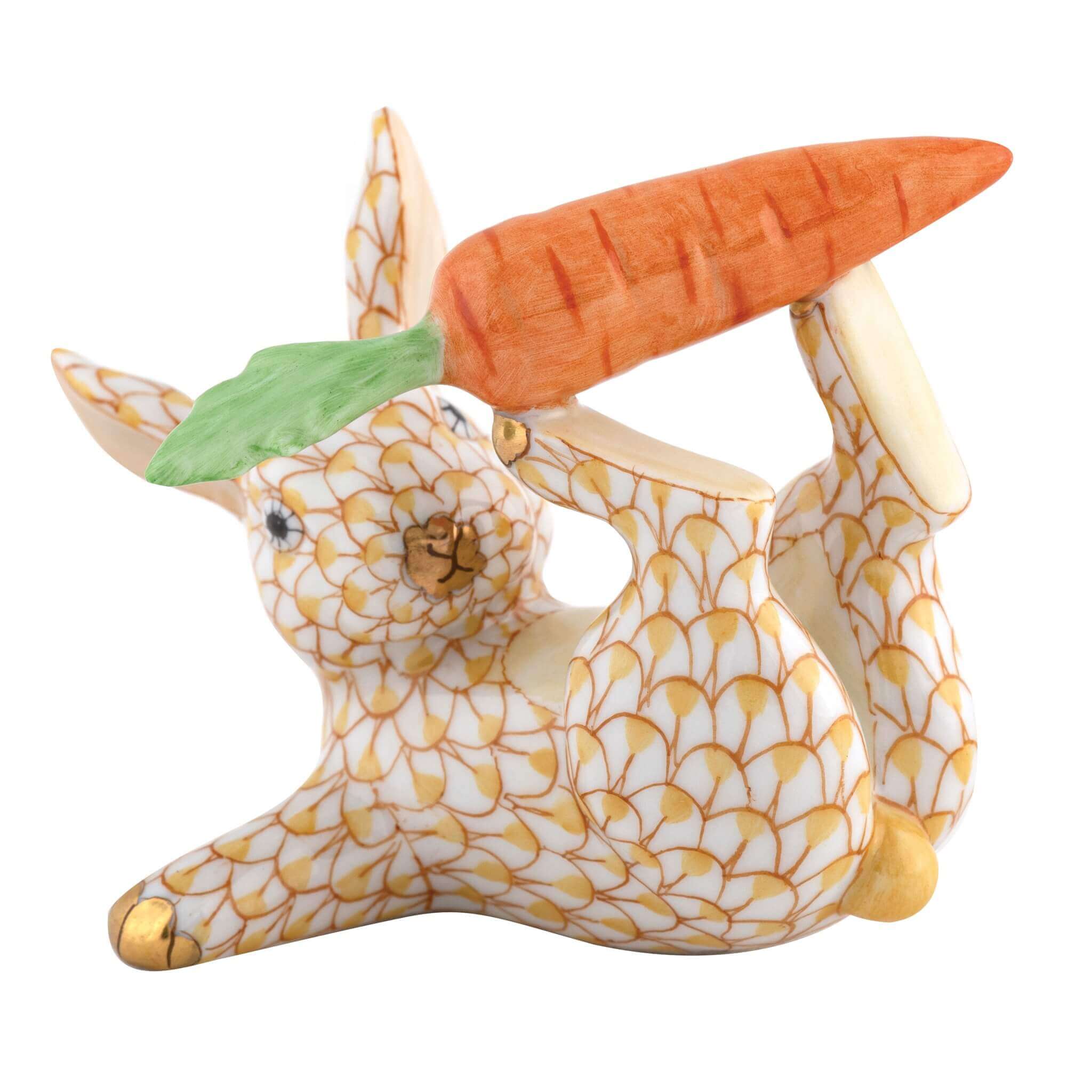 Herend Juggler Bunny figurine in Butterscotch with warm butterscotch yellow fishnet pattern with gold accents on a white background