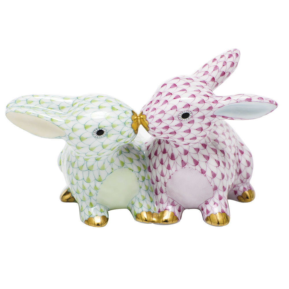 Hand-painted Herend Kissing Bunnies Figurine in Raspberry-Key Lime fishnet porcelain on a white background