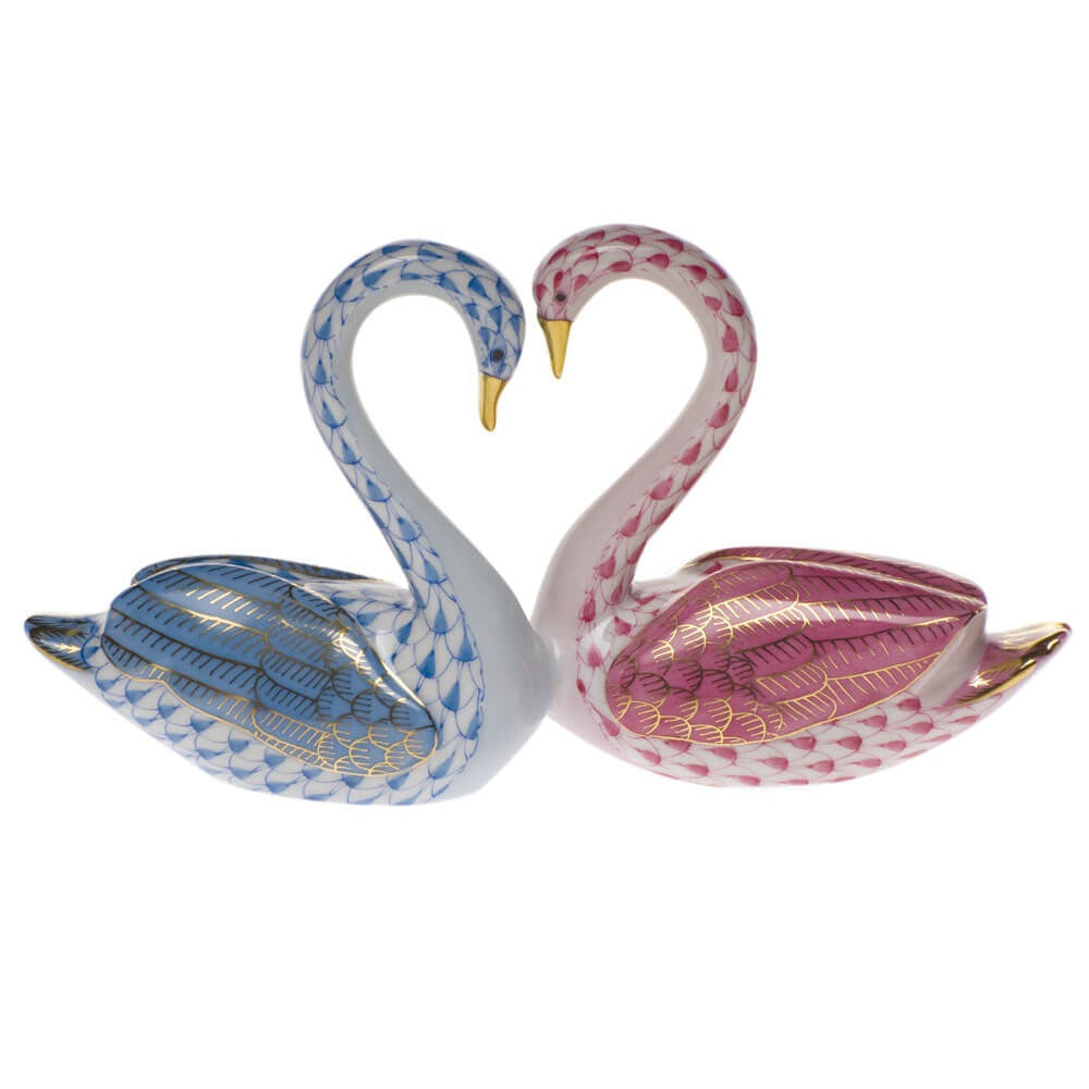 Hand-painted Herend Kissing Swans Figurine in Blue-Raspberry fishnet porcelain on a white background