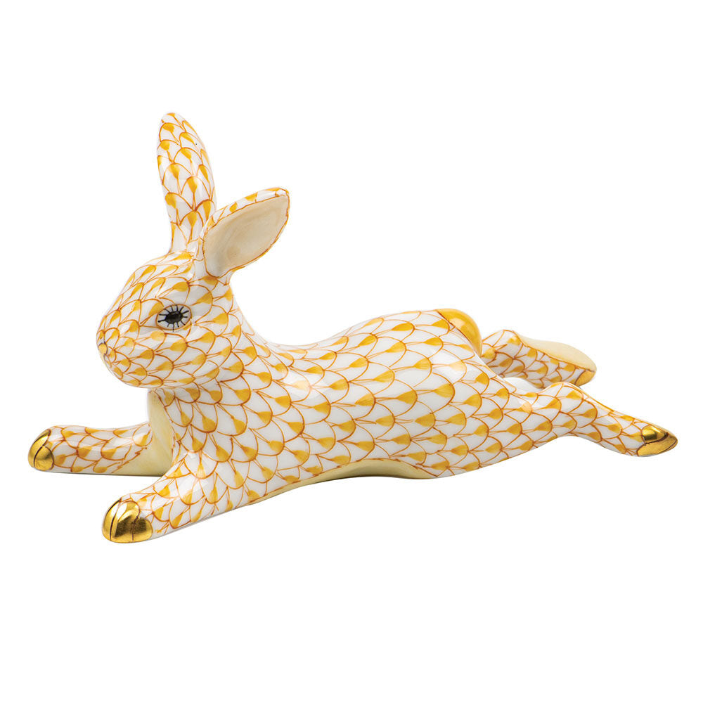 Hand-painted Herend Lounging Bunny Figurine in Butterscotch fishnet porcelain on a white background