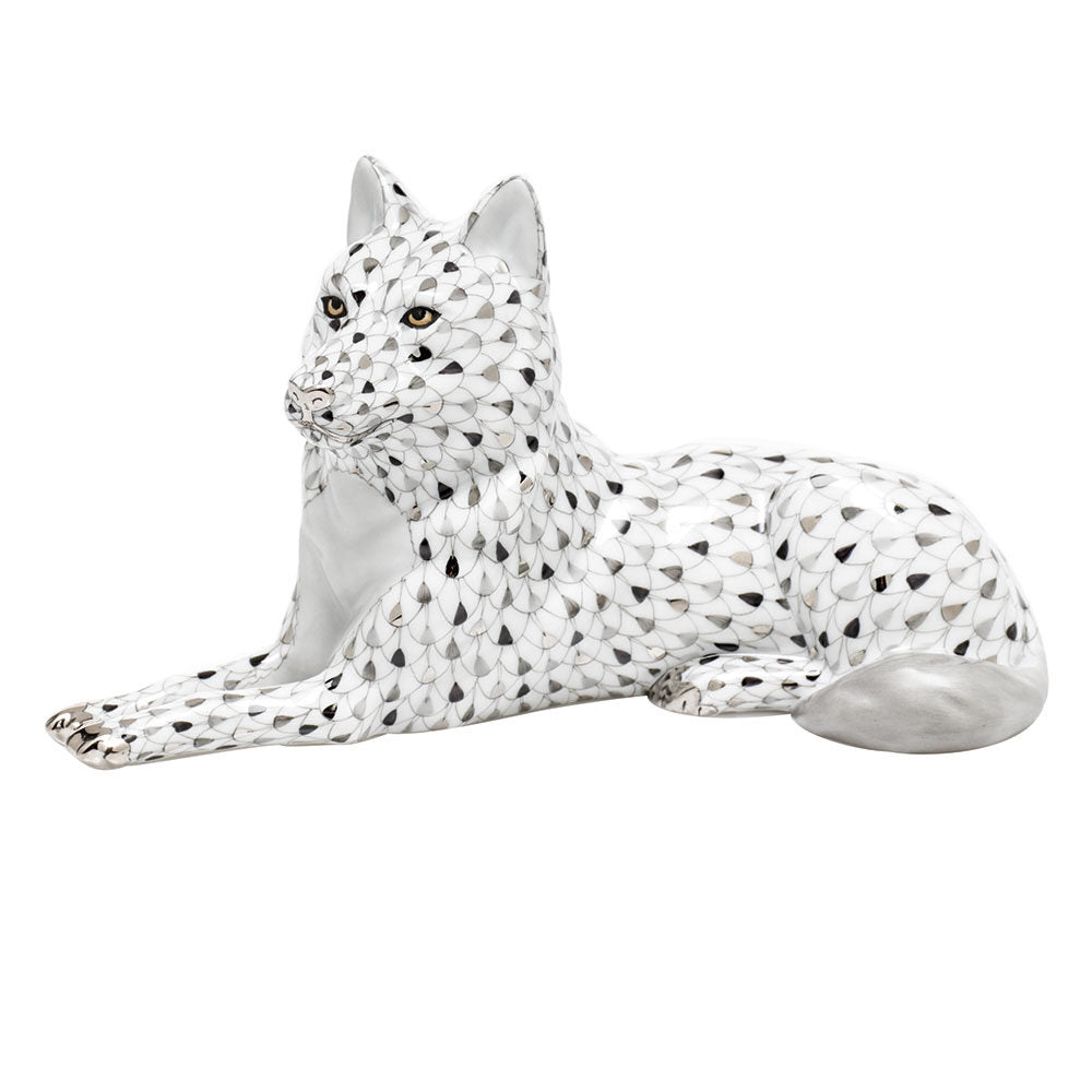 Hand-painted Herend Lying Wolf Figurine in fine porcelain, 7.75in L X 4.25in H, on a white background