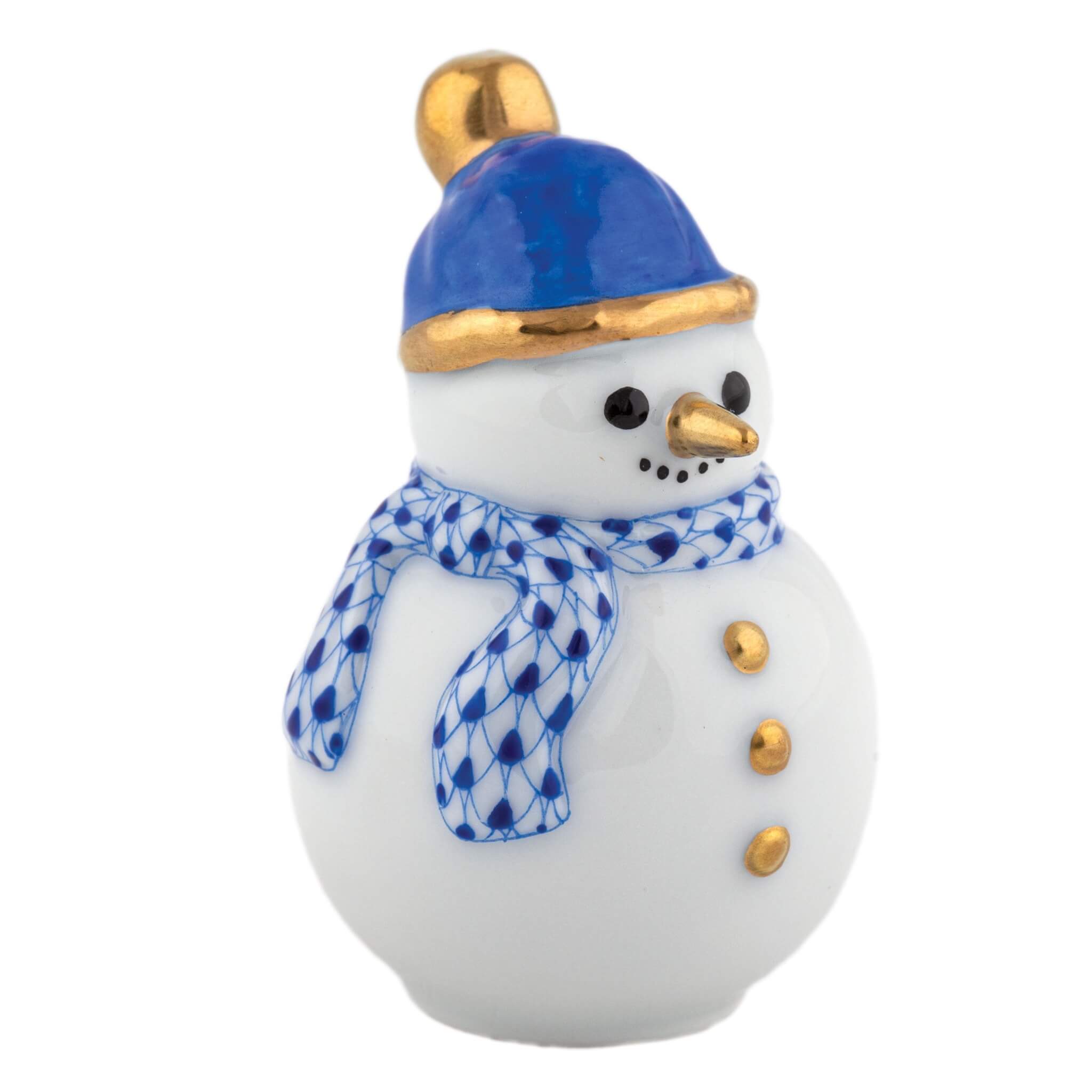Small snowman figurine with a blue hat, gold top, and blue and white scarf on a white background