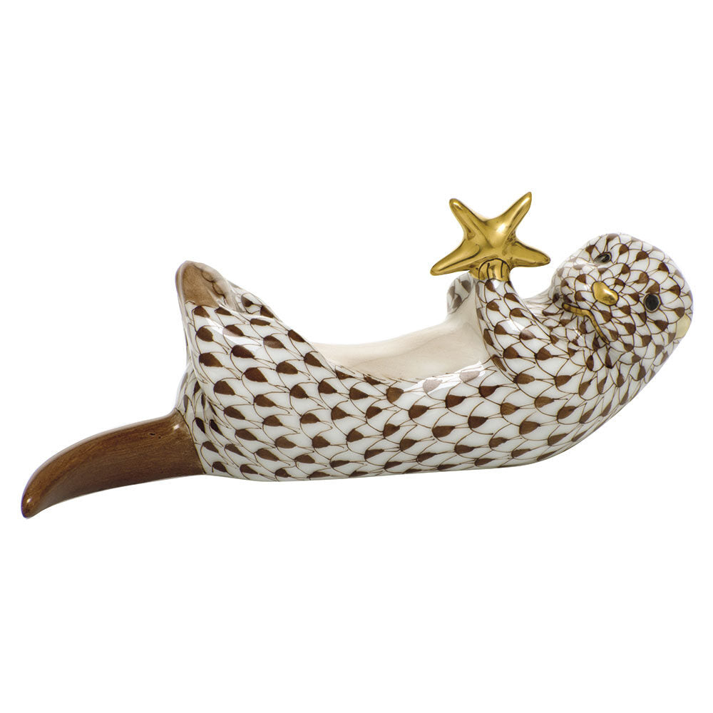 Hand-painted Herend Sea Otter with Starfish Figurine in Chocolate fishnet porcelain on a white background