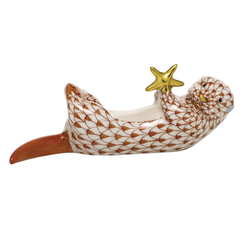 Hand-painted Herend Sea Otter with Starfish Figurine in Rust fishnet porcelain on a white background