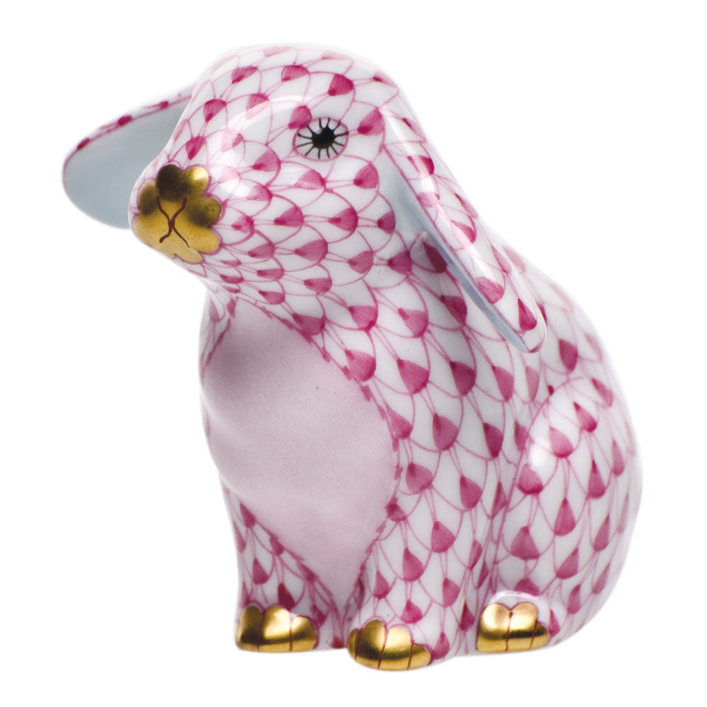 Hand-painted Herend Sitting Lop Ear Bunny Figurine in Raspberry fishnet porcelain on a white background