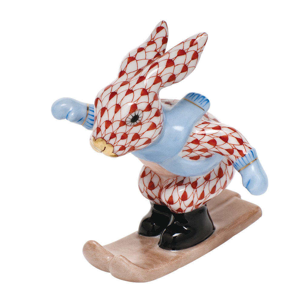 Hand-painted Herend Ski Bunny Figurine in Rust fishnet porcelain on a white background