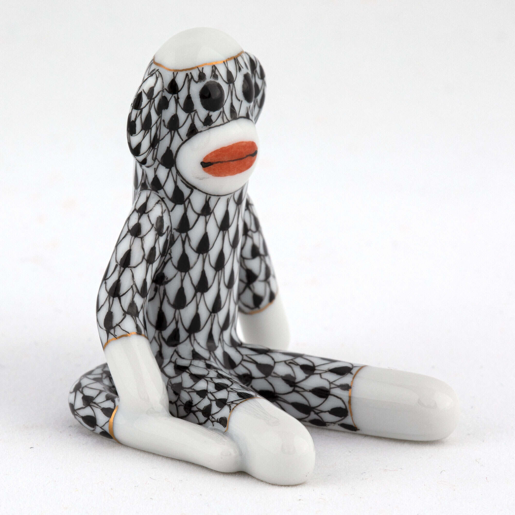 Sock Monkey Figurine in hand-painted Black porcelain by Herend of Hungary