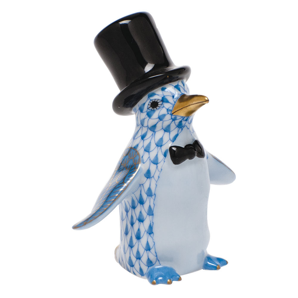 Hand-painted Herend Tuxedo Penguin Figurine in Blue fishnet porcelain on a white background