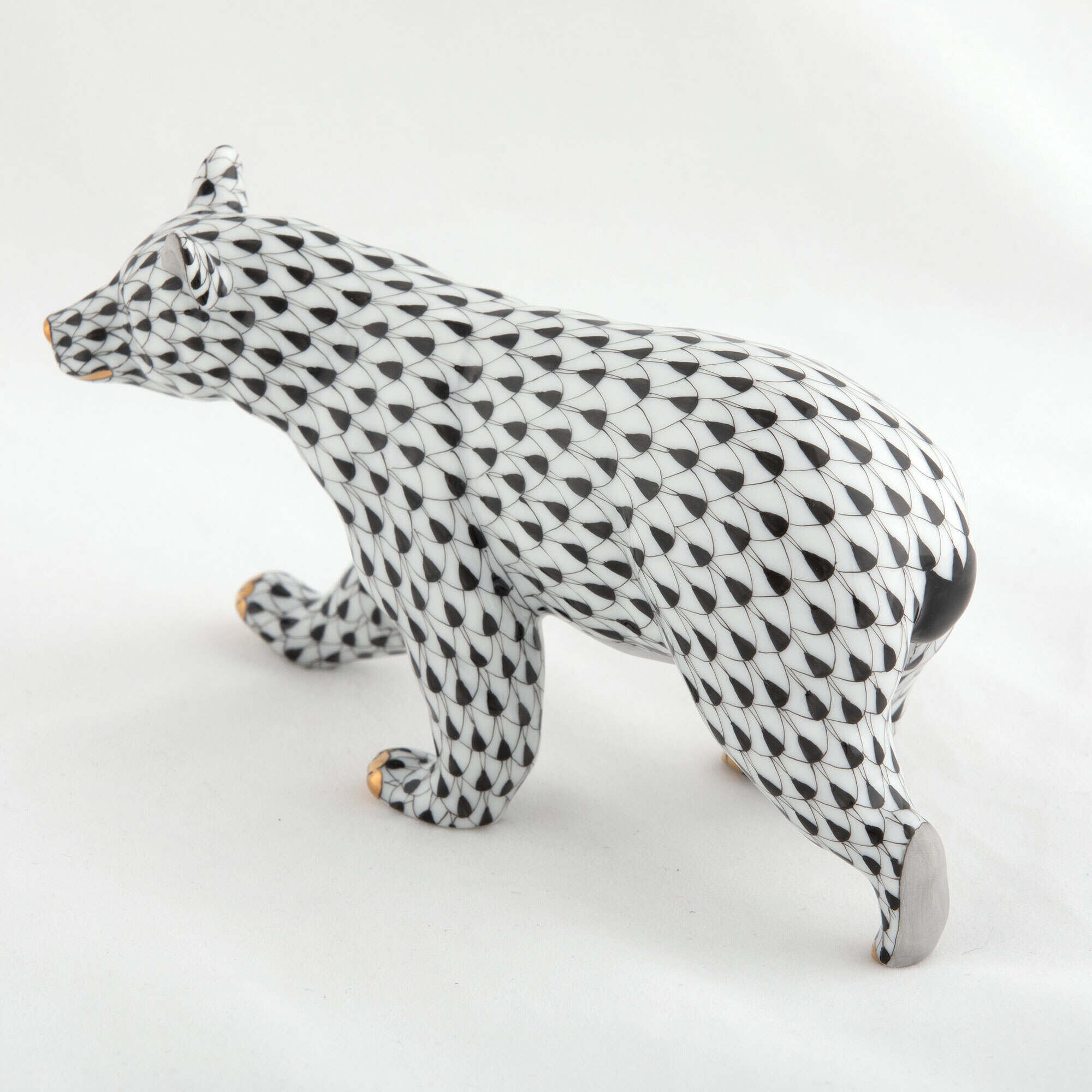 Hand-painted Herend Walking Bear Figurine in Black fishnet porcelain on a white background
