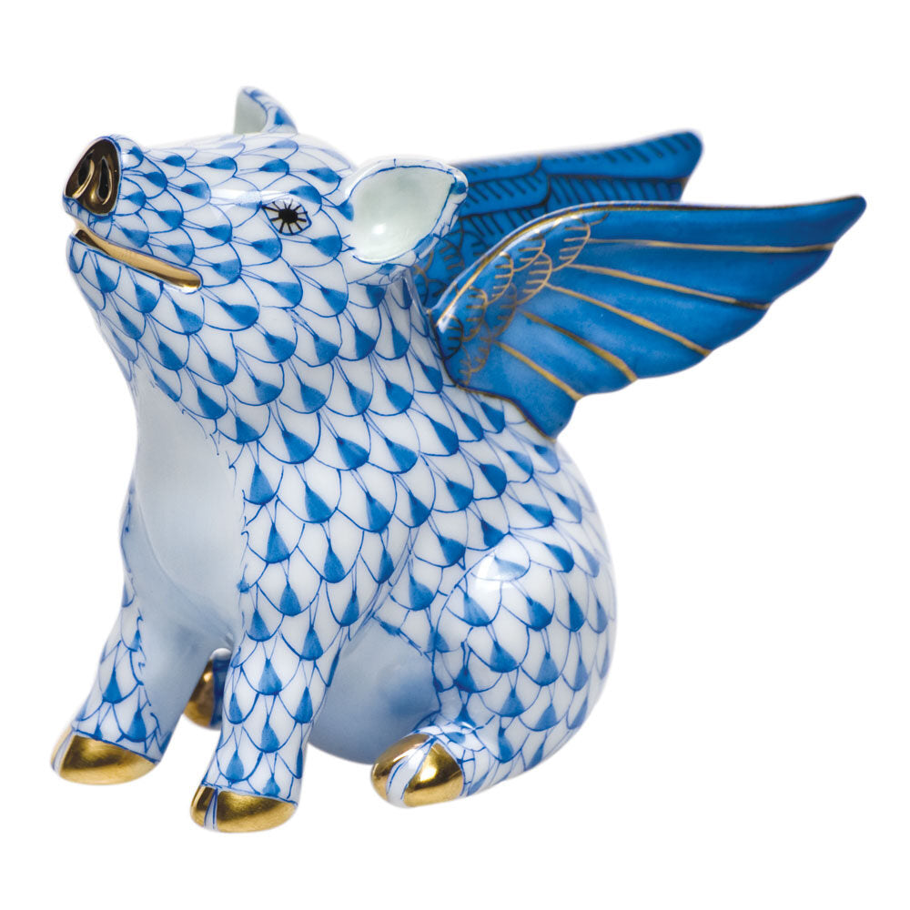Hand-painted Herend When Pigs Fly Figurine in Blue fishnet porcelain on a white background