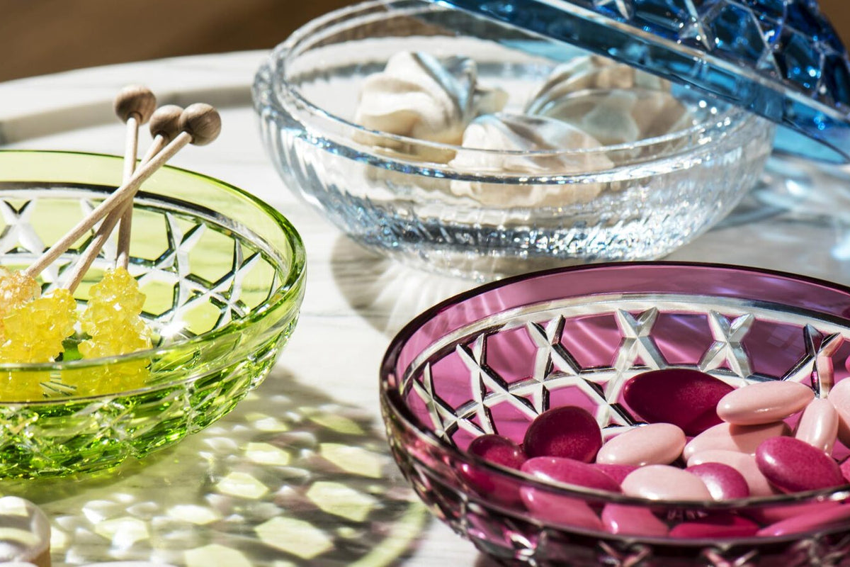 Saint-Louis Royal crystal cups in chartreuse, clear and amethyst on a marble table
