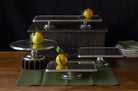 Match Pewter Milano stands styled with fruit