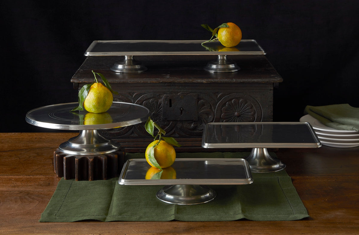 Match Pewter Milano stands styled with fruit