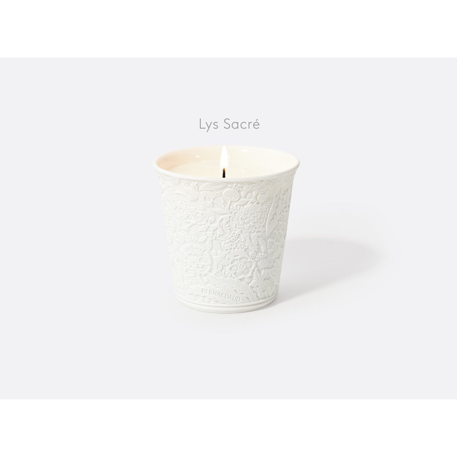 Bernardaud "Lys Sacré" refillable candle tumbler in engraved bisque porcelain 7 oz, Limoges porcelain, Home Fragrances collection, on a white background