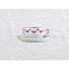 Bernardaud Tea cup and saucer, Limoges porcelain, Louis XV collection, on a white background