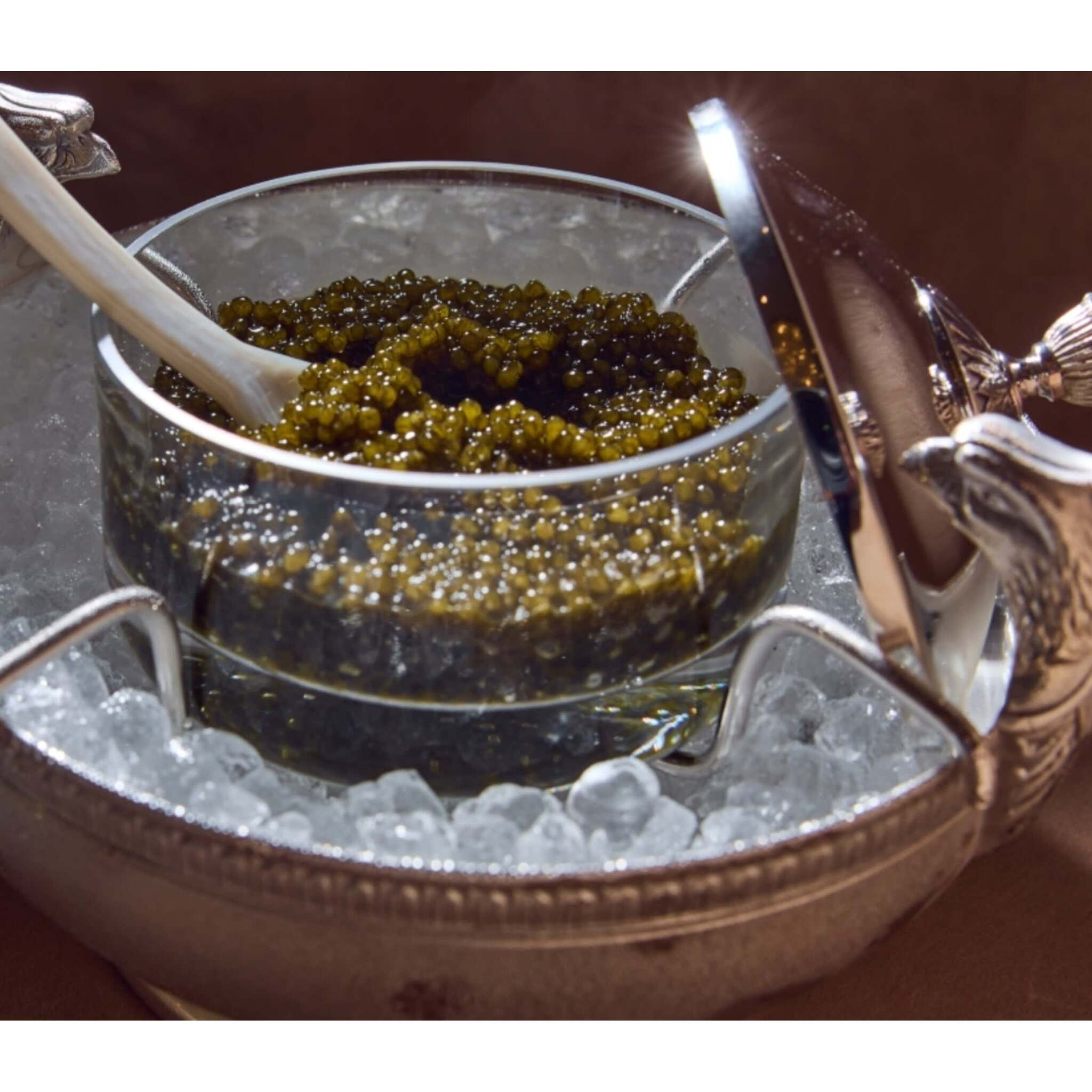 Christofle Champagne and Caviar Set in crystal on a white background
