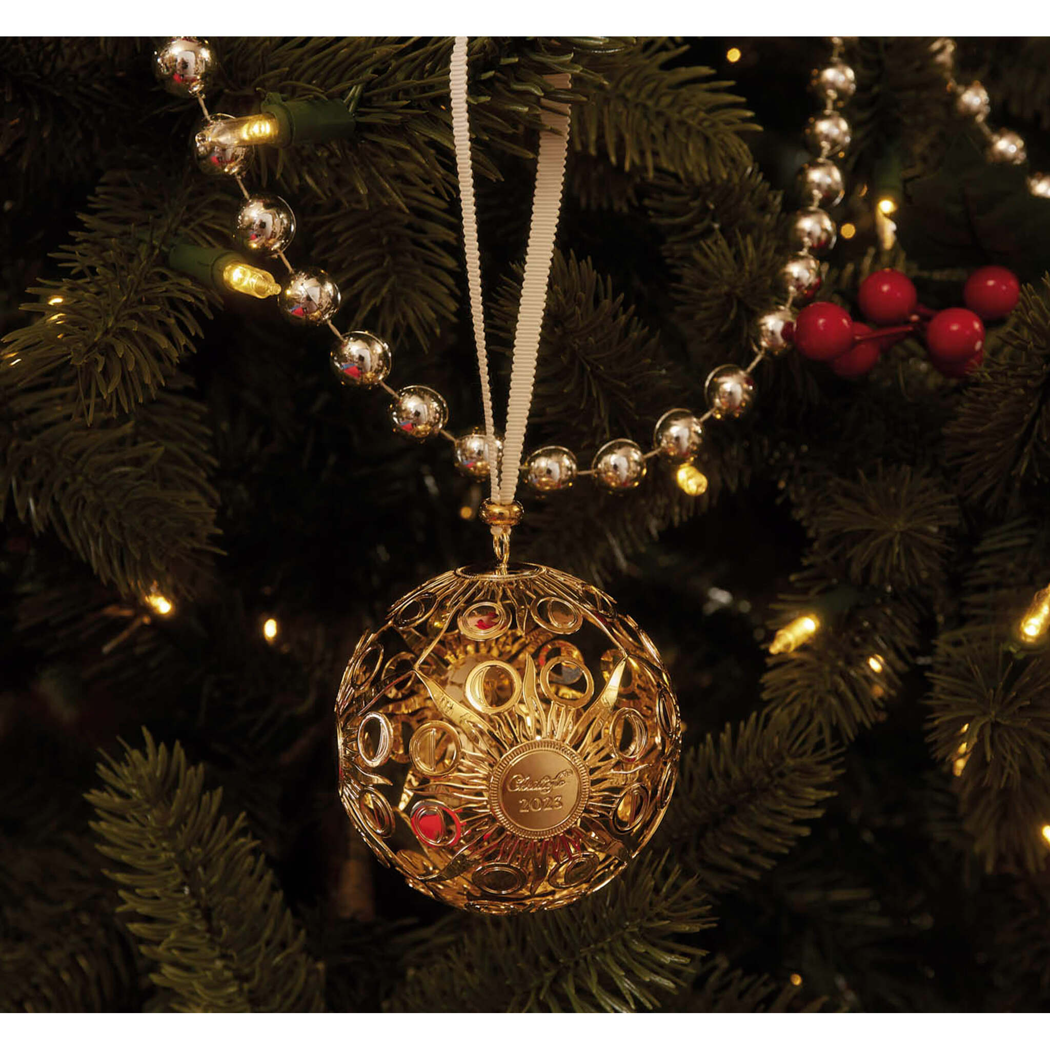 Christofle Rêve Cosmique Gold Gilded Silver-Plated Ornament - 2023 in silver-plate on a white background