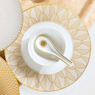 Christofle Malmaison Dinner Porcelain Plate Gold Finish in porcelain on a white background