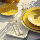 Christofle Porcelain Dinner Plate in silver-plate on a white background