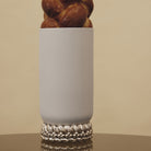 Christofle Babylone Large Porcelain Vase in sterling silver on a white background