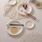 Christofle Silver-Plated Black Chinese Chopsticks in silver-plate on a white background