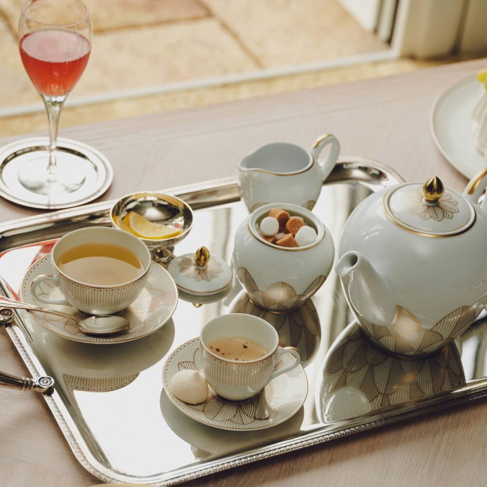 Christofle Malmaison Gold Porcelain Round Teapot - 50 Oz in porcelain on a white background