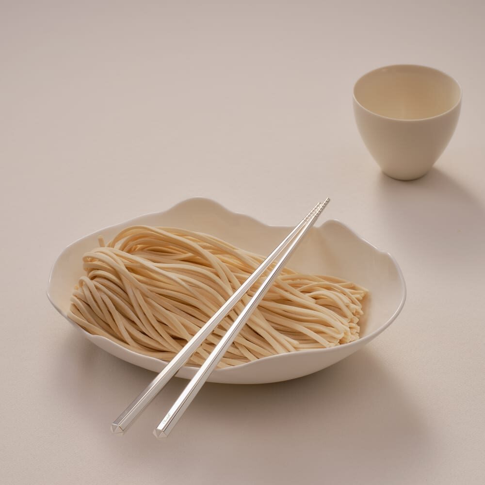 Christofle Infini Silver-Plated Chopsticks in silver-plate on a white background