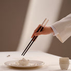 Christofle Jardin d'Eden Rose Gold Japanese Chopsticks on a white background