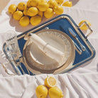 Christofle Malmaison Porcelain Underplate Gold Finish in porcelain on a white background