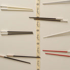 Christofle Silver-Plated Black Japanese Chopsticks in silver-plate on a white background