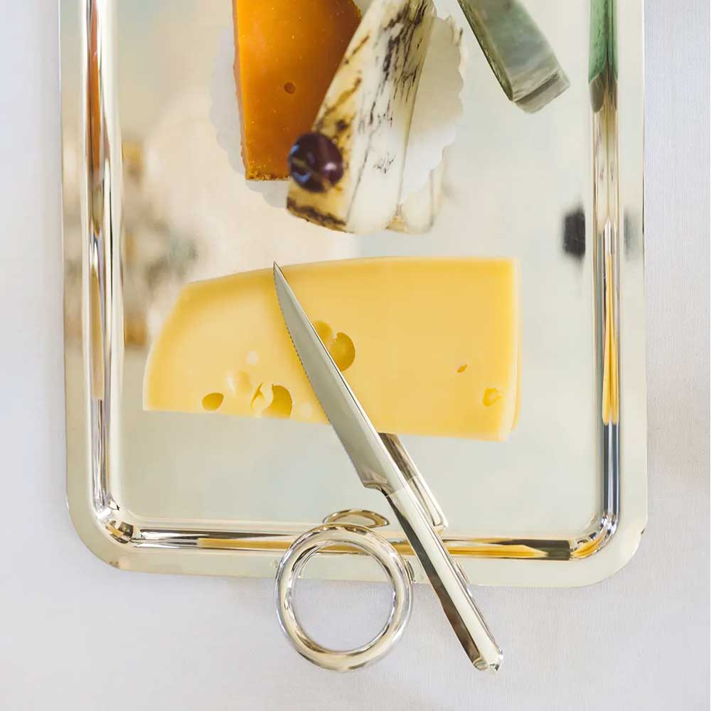 cheese served on christofle virtigo large rectangular tray with circular handles on two sides