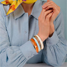 Halcyon Days Preppy Push-On Enamel Bangle in Orange & Gold, alternate view
