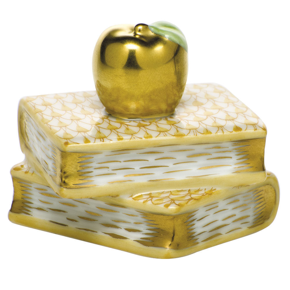 Hand-painted Herend Apple on Books Figurine in Butterscotch fishnet porcelain on a white background