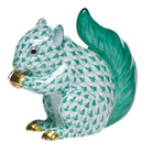 Hand-painted Herend Baby Squirrel Figurine in Green fishnet porcelain on a white background