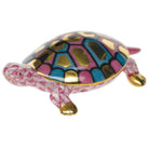 Hand-painted Herend Baby Turtle Figurine in Raspberry fishnet porcelain on a white background