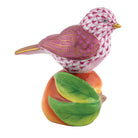 Hand-painted Herend Bird on Peach Figurine in Raspberry fishnet porcelain on a white background