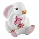 Herend Bunny with Cross figurine in Raspberry with raspberry pink fishnet pattern with gold accents on a white background