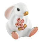 Herend Bunny with Cross figurine in Rust with red-orange fishnet pattern with gold accents on a white background